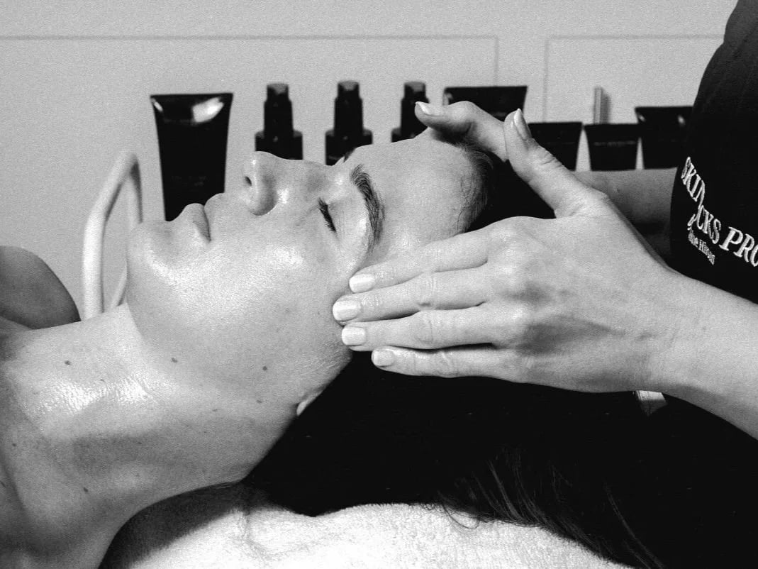 Close-up of a facial treatment in progress.